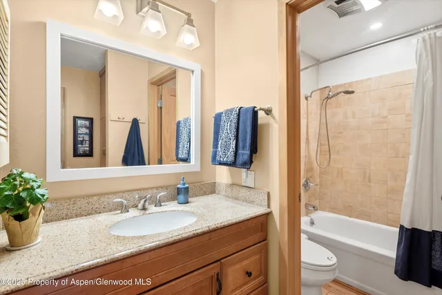 a view of a hallway with washer and dryer