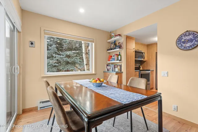 a view of a dining room with furniture window and wooden floor