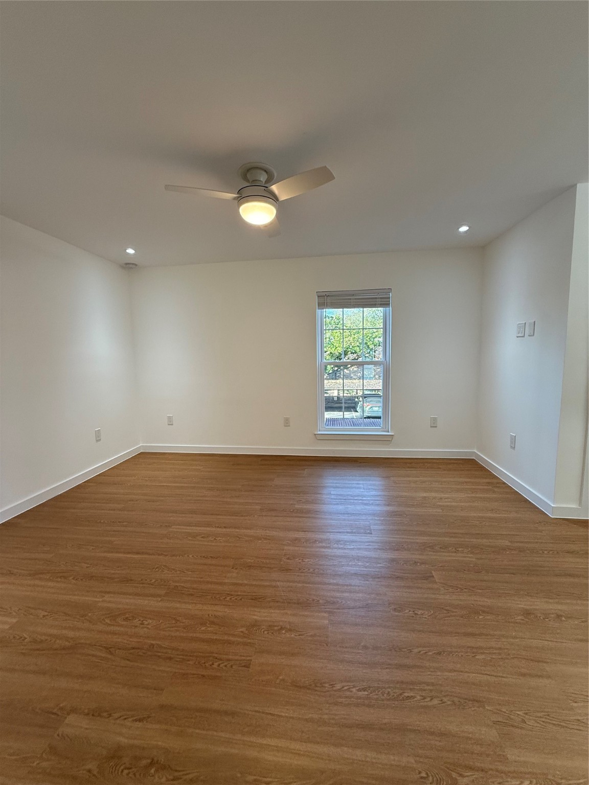 3400 Timmons Lane, Unit 52 56 Houston, TX 77027 - Photo 11 of 40 an empty room with wooden floor and windows