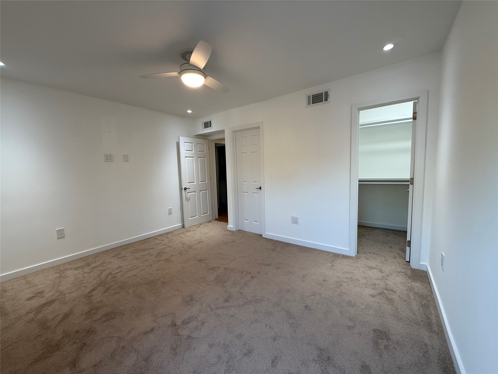 3400 Timmons Lane, Unit 52 56 Houston, TX 77027 - Photo 19 of 40 an empty room with an entryway and fan