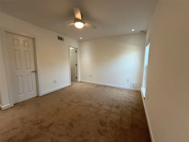 an empty room with a bathroom