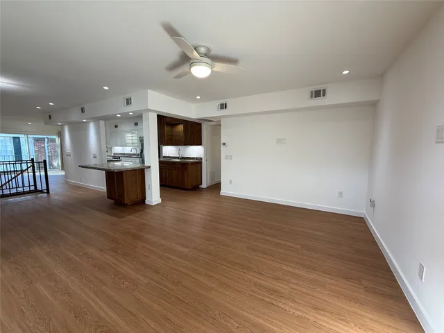 a view of kitchen and dining room with wooden floor