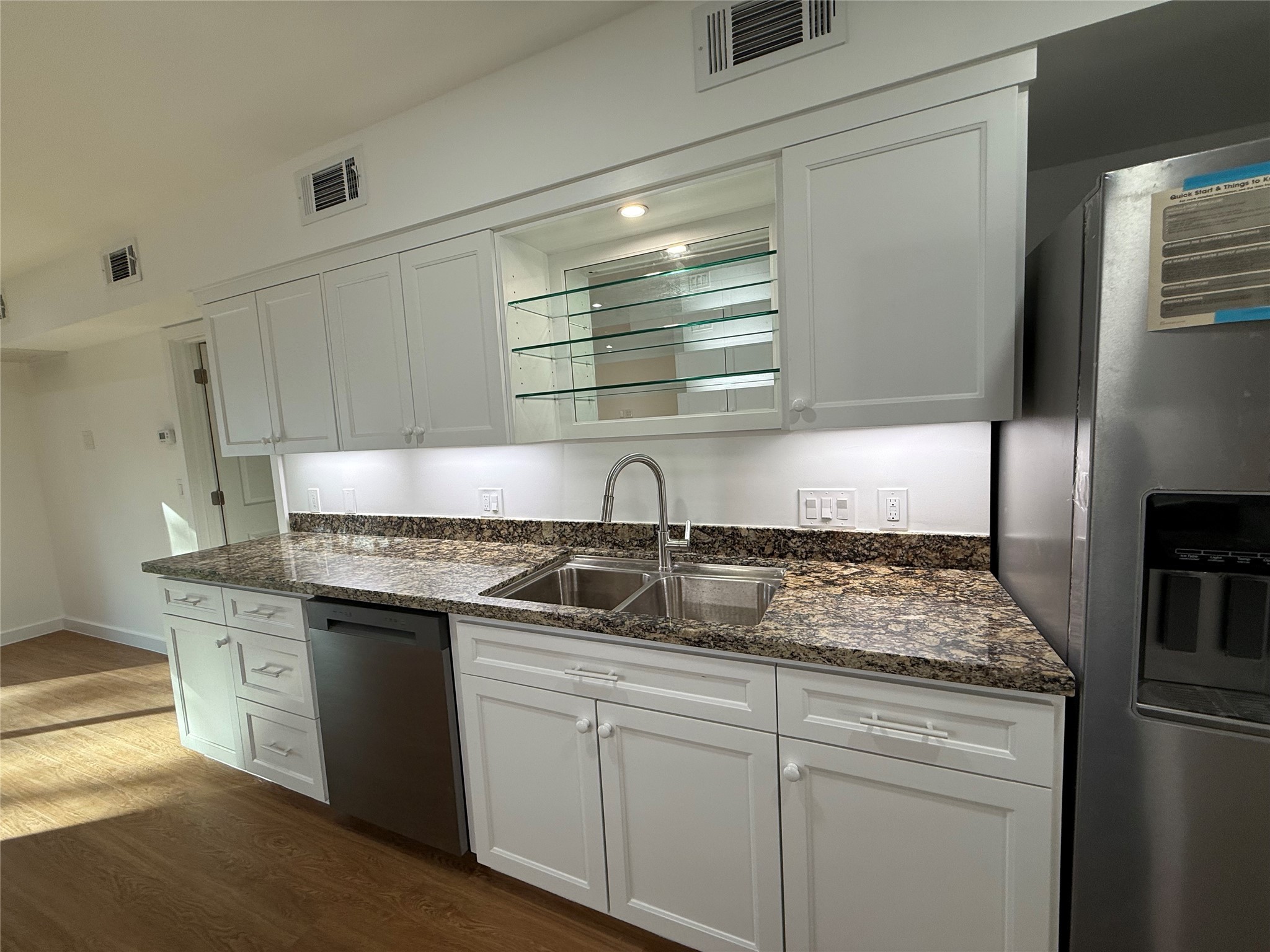 3400 Timmons Lane, Unit 52 56 Houston, TX 77027 - Photo 34 of 40 a kitchen with stainless steel appliances granite countertop a sink stove and cabinets
