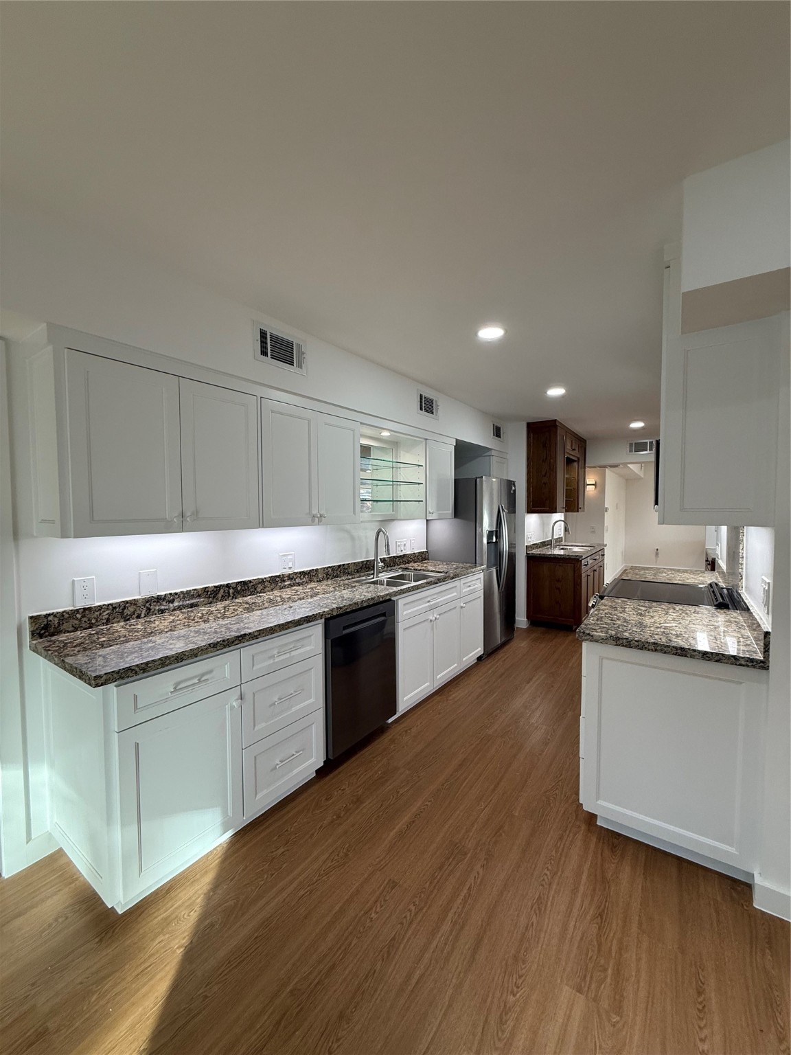 3400 Timmons Lane, Unit 52 56 Houston, TX 77027 - Photo 37 of 40 a kitchen with stainless steel appliances granite countertop a sink stove and refrigerator