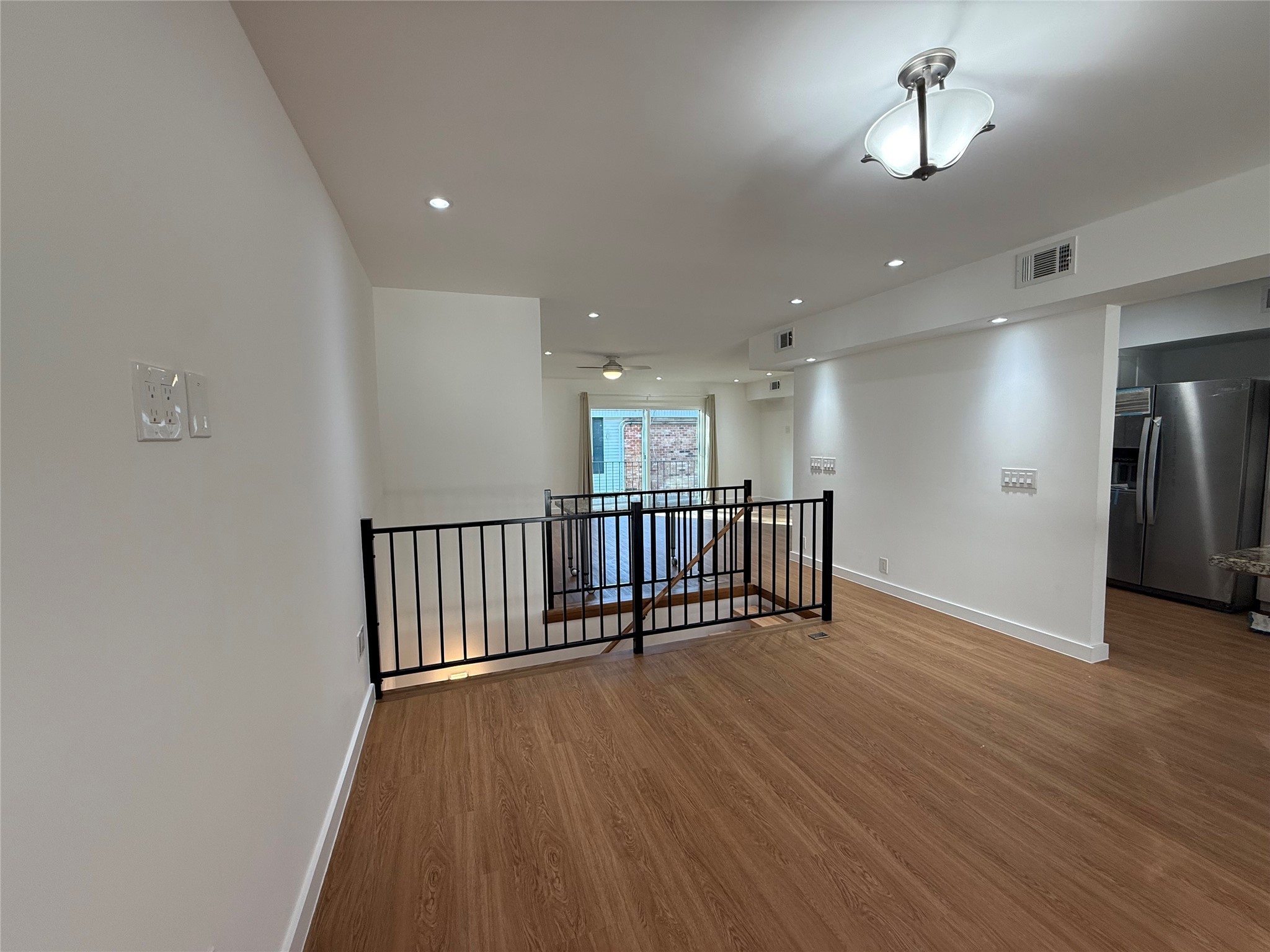 3400 Timmons Lane, Unit 52 56 Houston, TX 77027 - Photo 38 of 40 wooden floor in an empty room with a window