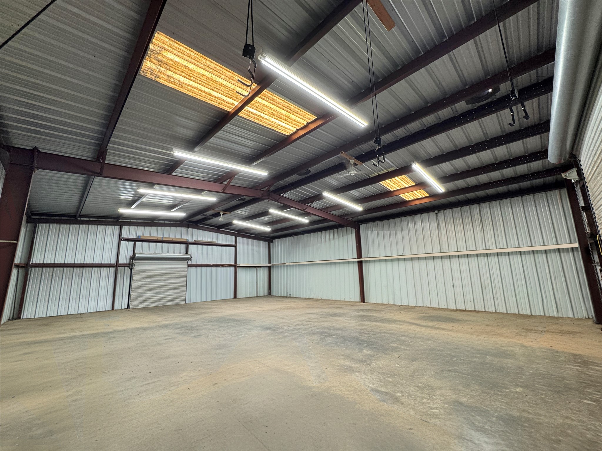 30309 Live Oak Trail Georgetown, TX 78633 - Photo 3 of 40 50’x40’ workshop- Virtually removed stored items.