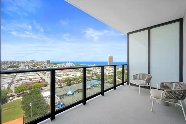 a view of balcony with furniture