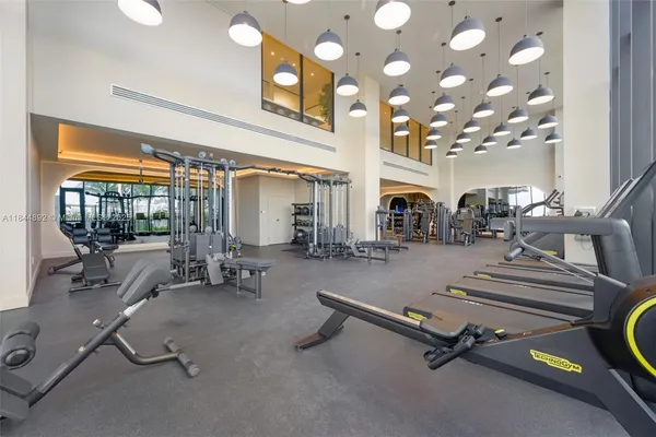 a room with gym equipment and a large window