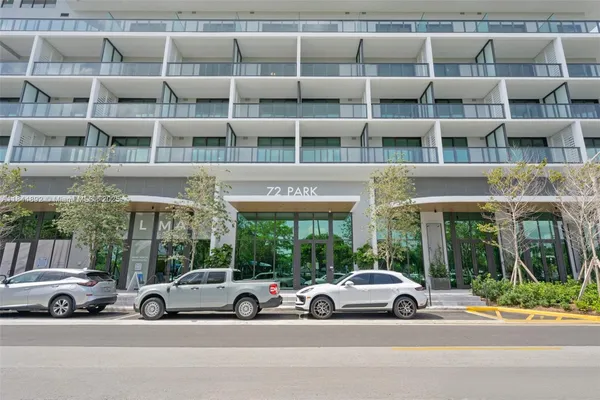 a view of a car parked in front of a building