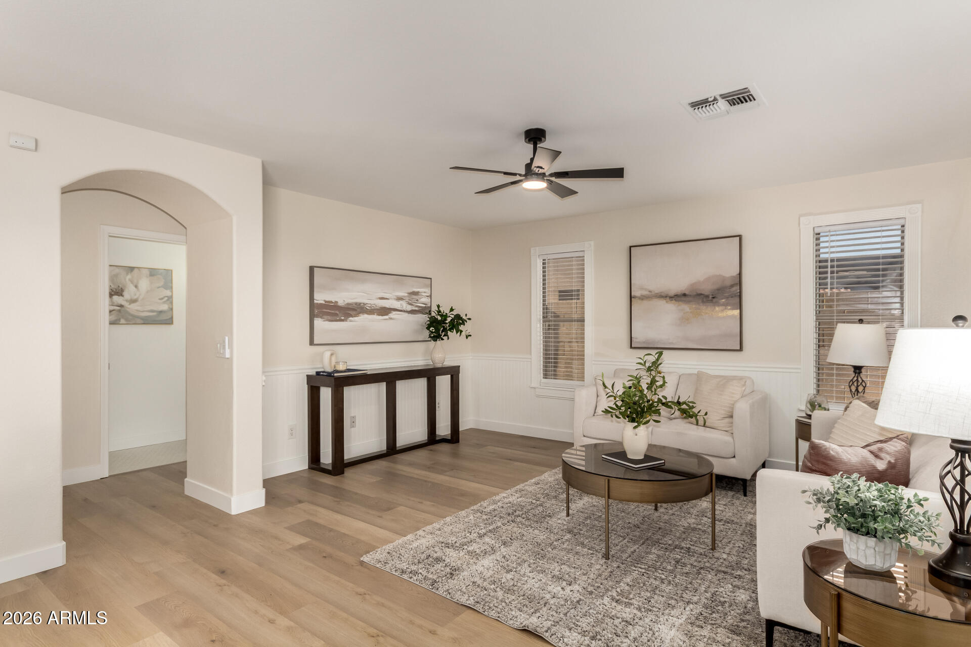 1814 East Milky Way Gilbert, AZ 85295 - Photo 1 of 28 a living room with furniture and a wooden floor