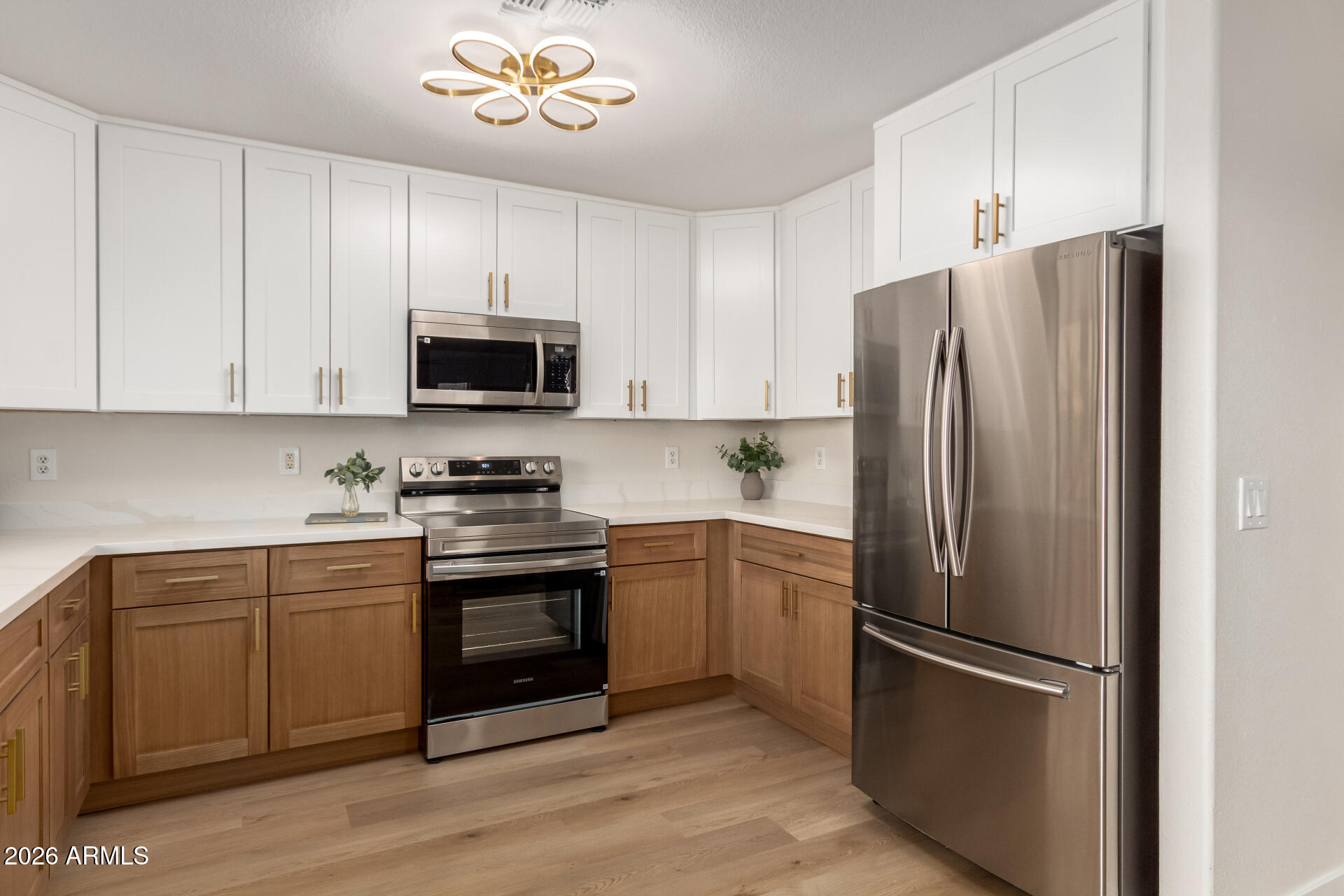 1814 East Milky Way Gilbert, AZ 85295 - Photo 8 of 28 a kitchen with stainless steel appliances a refrigerator stove and microwave