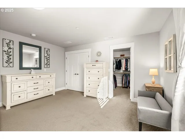 a view of a bedroom with furniture and cabinet