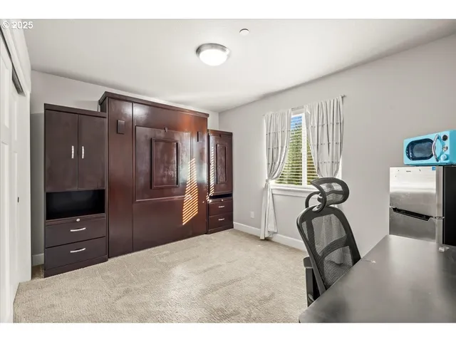 a bedroom with furniture and a window