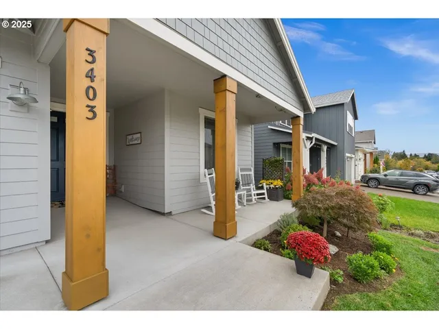 a view of a porch with furniture and floor to ceiling window