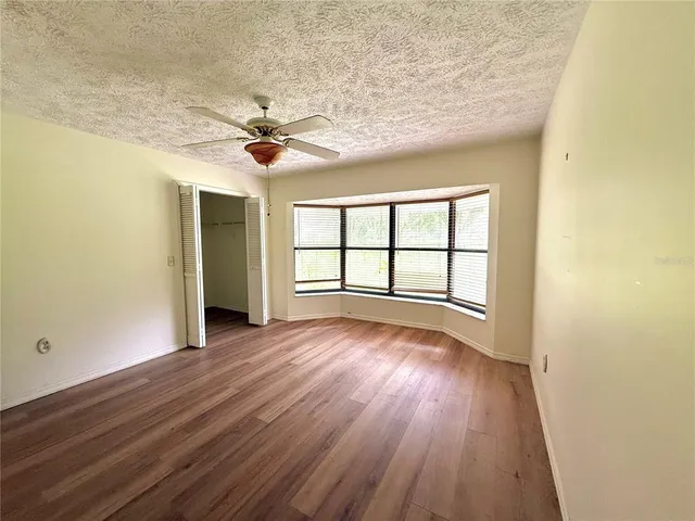 a bathroom with a sink a shower and a mirror