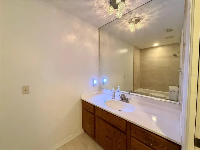 a bathroom with a sink and a shower