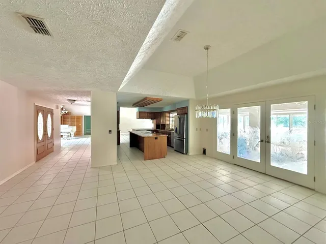 a view of an empty room with windows