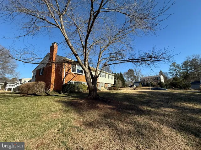 a view of a yard with a car parked