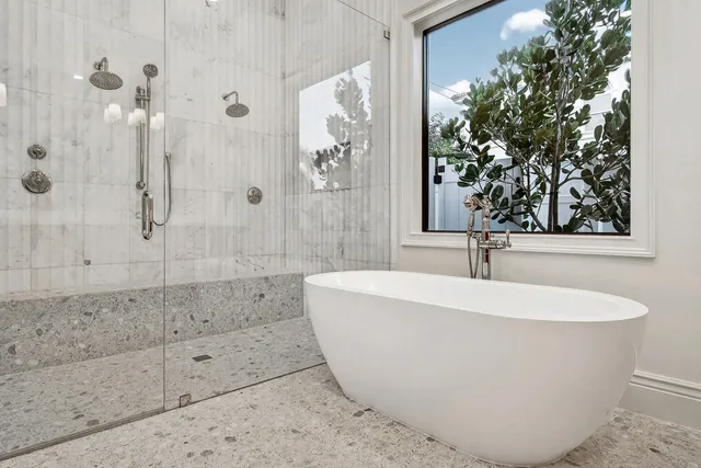 a white bath tub sitting in a bathroom
