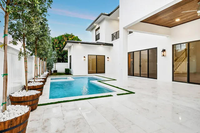 a view of swimming pool with seating space