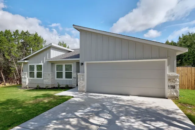 a view of a house with a garden