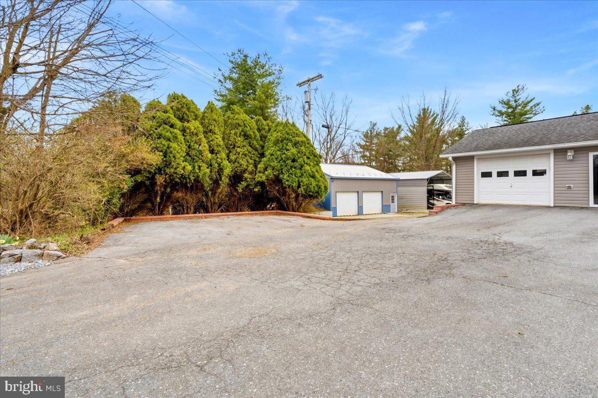 18711 Burnside Bridge Road Sharpsburg, MD 21782 - Photo 2 of 9 a view of a house with a yard and potted plants