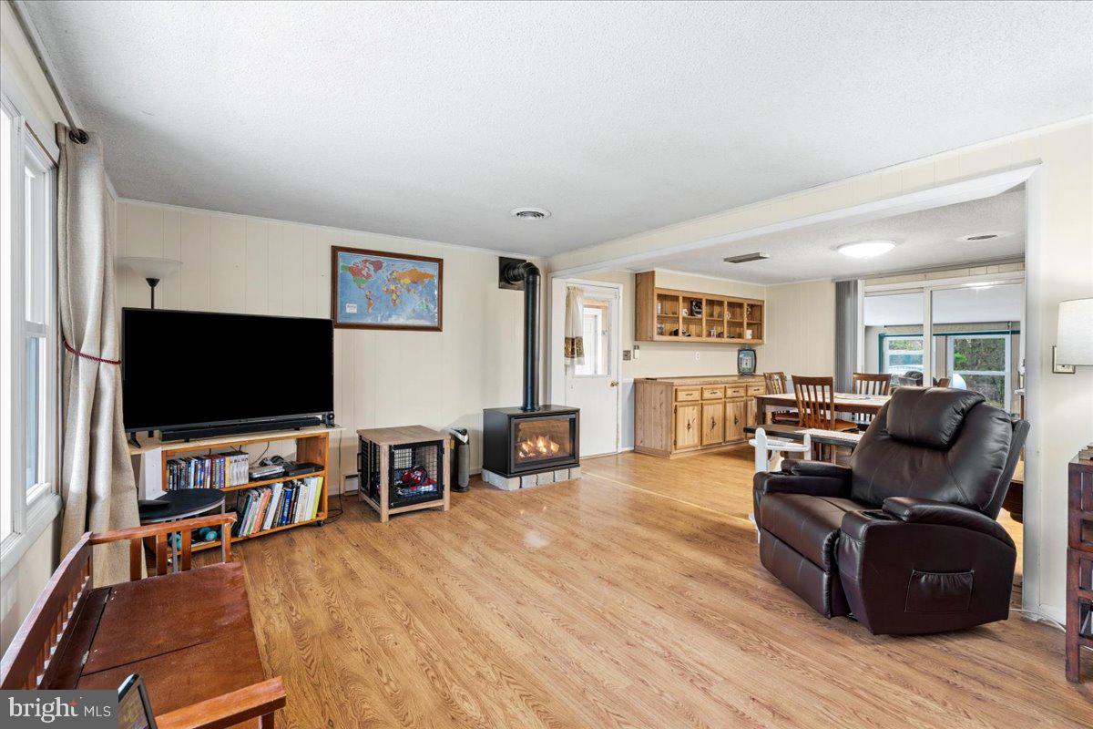 18711 Burnside Bridge Road Sharpsburg, MD 21782 - Photo 5 of 9 a living room with furniture and a flat screen tv