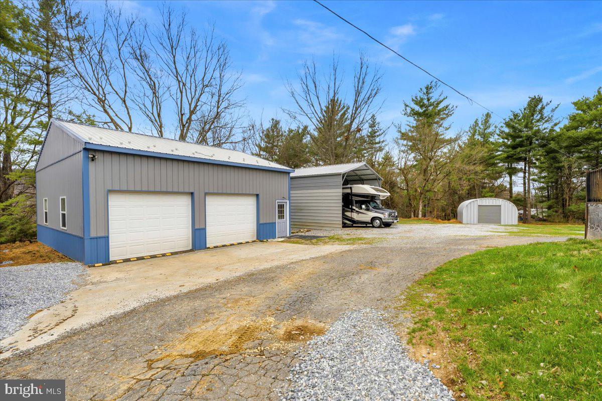 18711 Burnside Bridge Road Sharpsburg, MD 21782 - Photo 7 of 9 a view of a house with a yard and garage