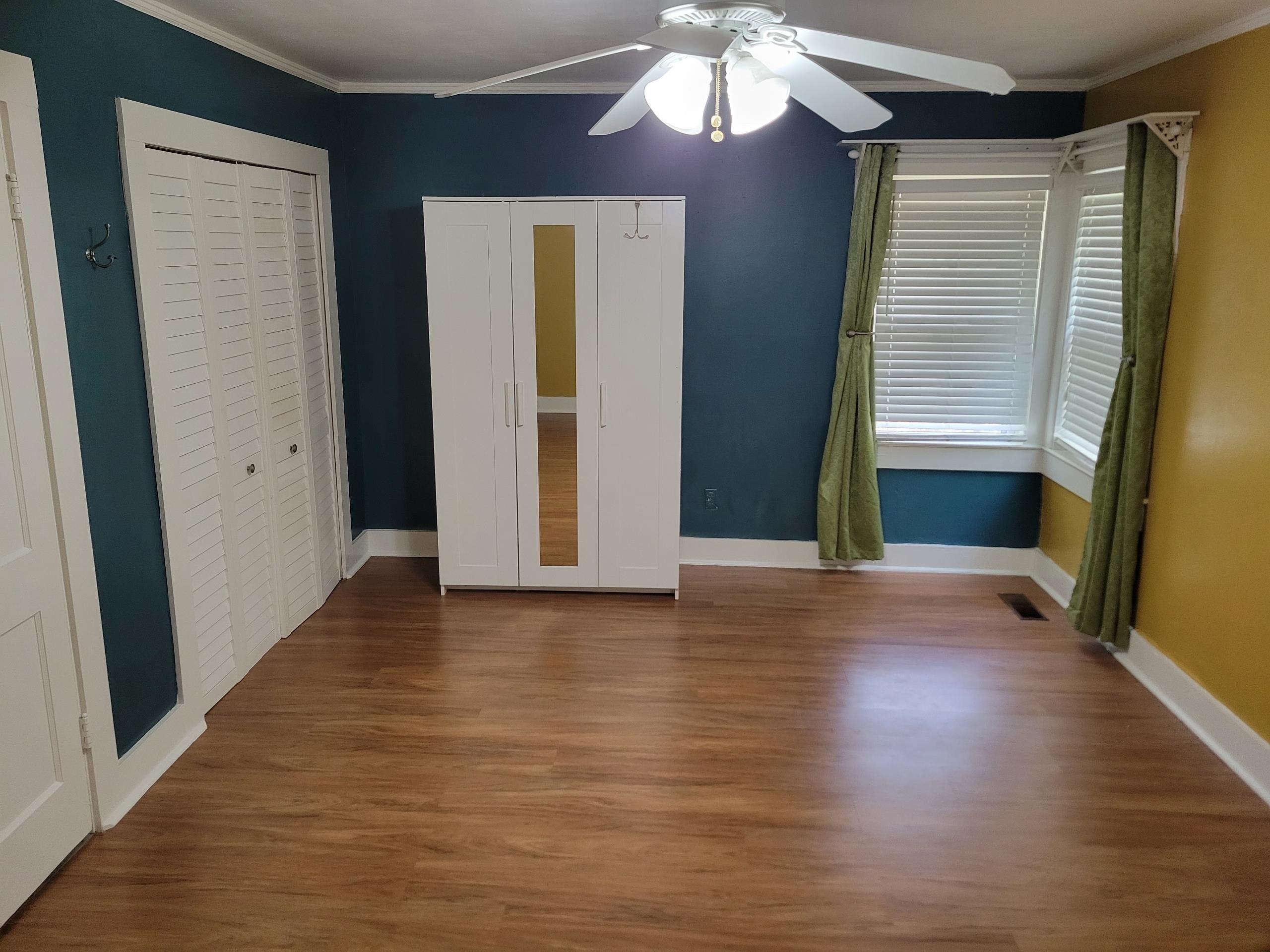 3580 Allandale Lane Memphis, TN 38111 - Photo 4 of 11 an empty room with wooden floor and windows