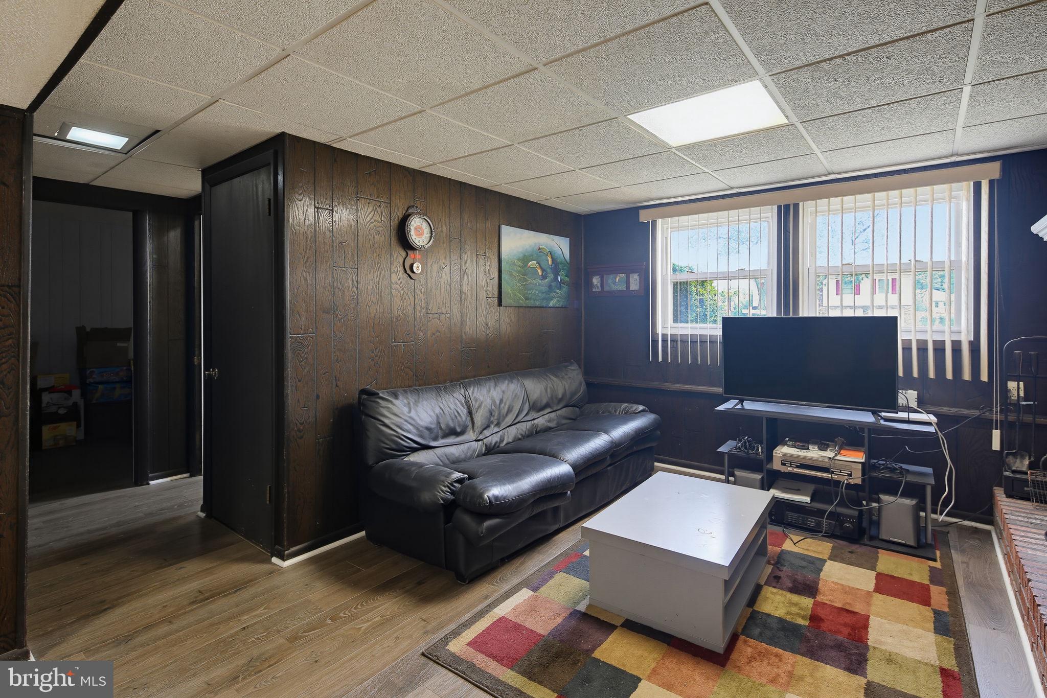 7802 Bastille Road Severn, MD 21144 - Photo 24 of 34 Cozy basement retreat with natural light.
