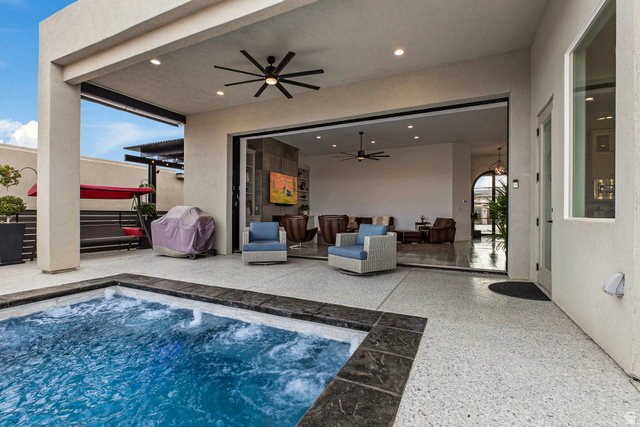 3022 West Sesia Way St. George, UT 84770 - Photo 34 of 52 Swimming pool featuring a patio, area for grilling, outdoor furniture, and a hot tub