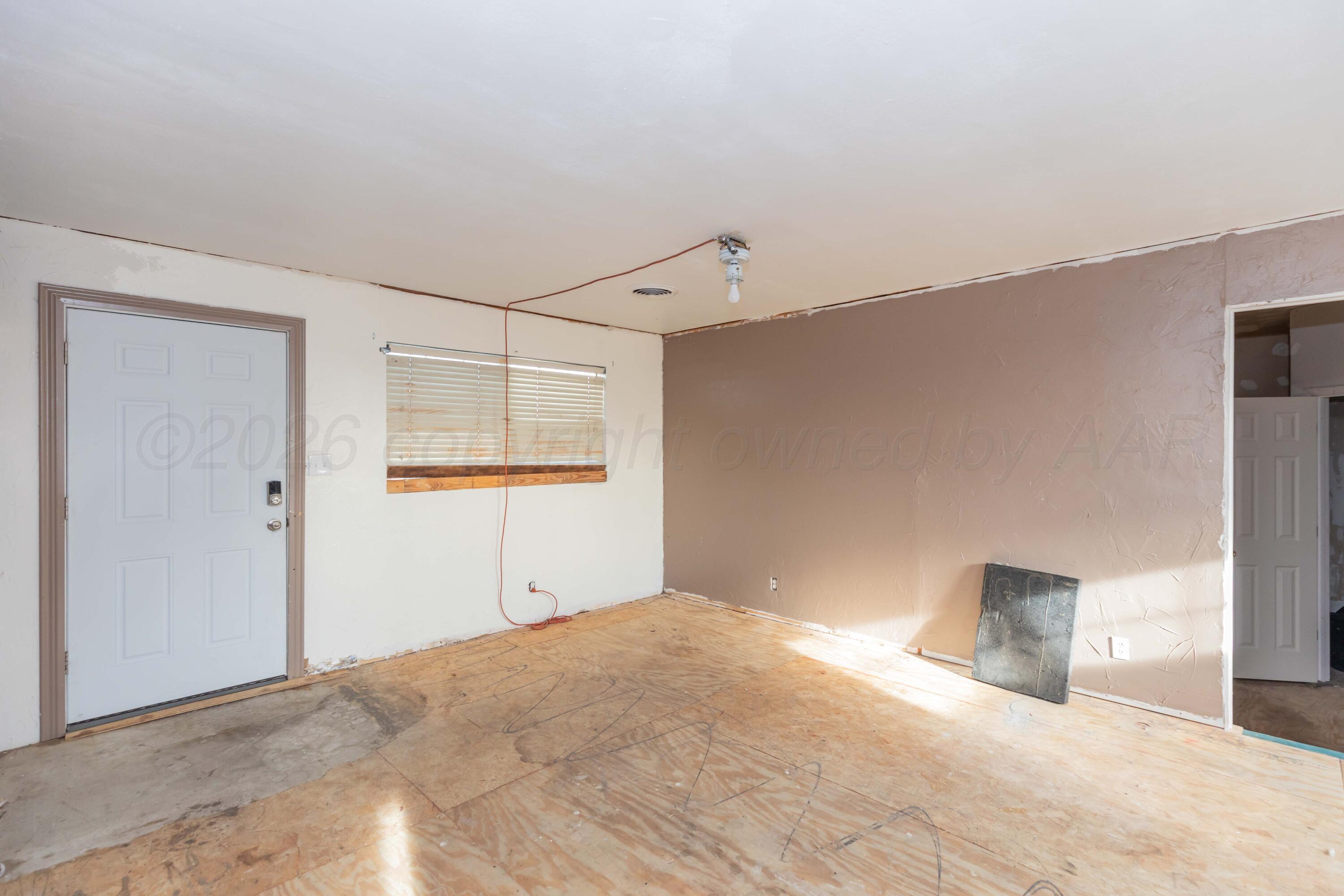 107 Inverness Street Borger, TX 79007 - Photo 6 of 22 a view of a big room with closet and cabinet