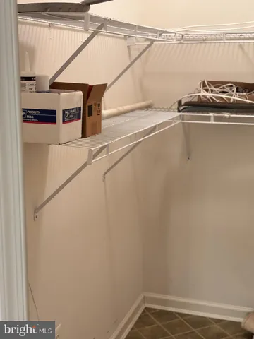 a kitchen with granite countertop a sink and a stove