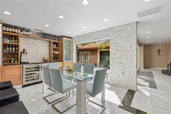 a dining room with furniture a window and wooden floor