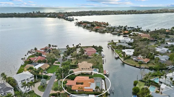 an aerial view of a house with a lake view