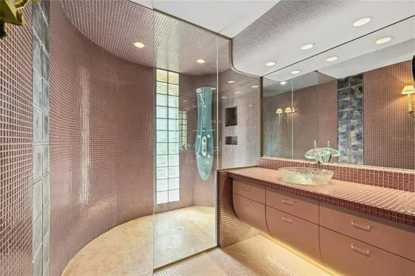 a spacious bathroom with a sink mirror and a shower