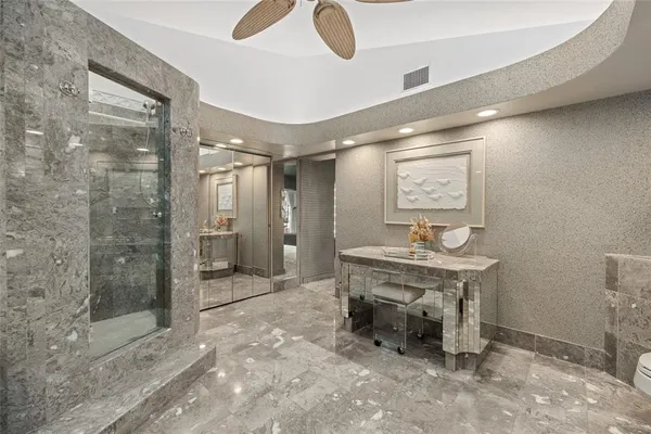 a view of a large room with wooden floor and furniture