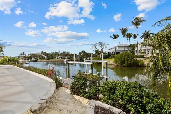 a view of a lake with a house in the background