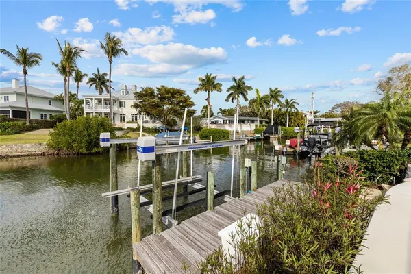 an aerial view of a house with a lake view