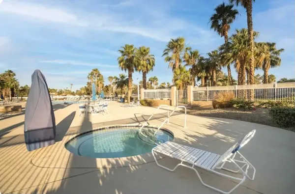 a view of a swimming pool with a patio