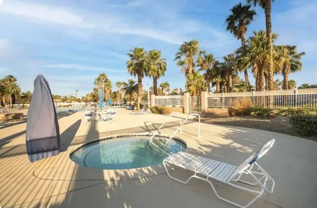 a view of a swimming pool with a patio