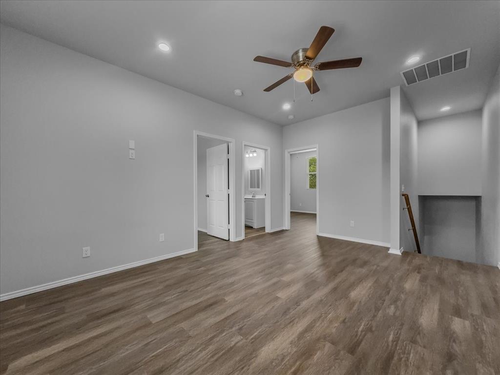 2 Bowling Lane Blue Ridge, TX 75424 - Photo 9 of 14 a view of an empty room with wooden floor and a ceiling fan