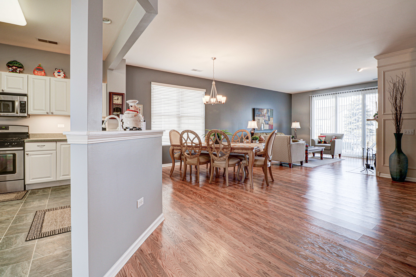 13616 Fallow Drive Huntley, IL 60142 - Photo 3 of 21 a view of a dining room with furniture window and wooden floor