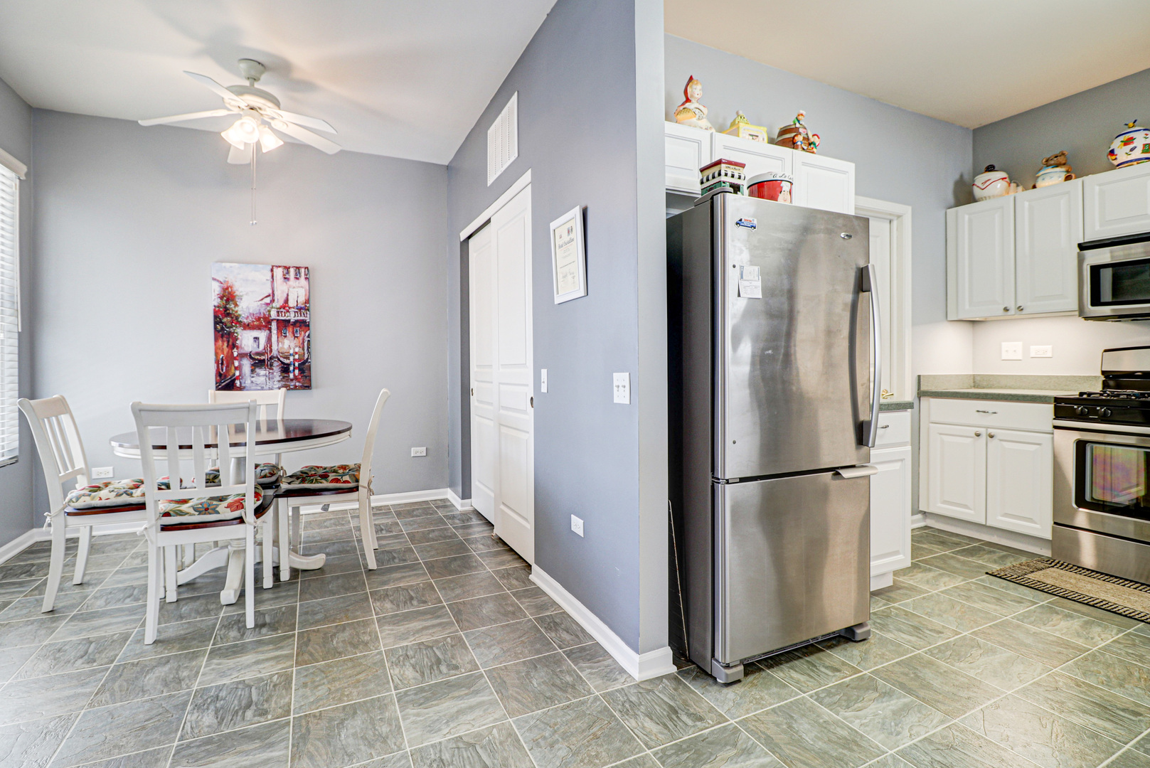 13616 Fallow Drive Huntley, IL 60142 - Photo 5 of 21 a kitchen with stainless steel appliances a refrigerator and a stove top oven
