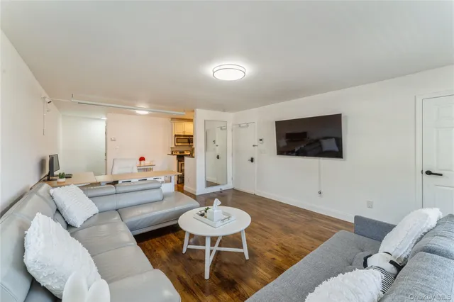 a view of kitchen with cabinets and wooden floor