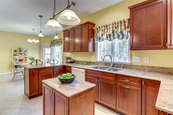 27 A Lawton Road, Unit A Shirley, MA 01464 - Photo 13 of 30 a kitchen with a sink cabinets and wooden floor