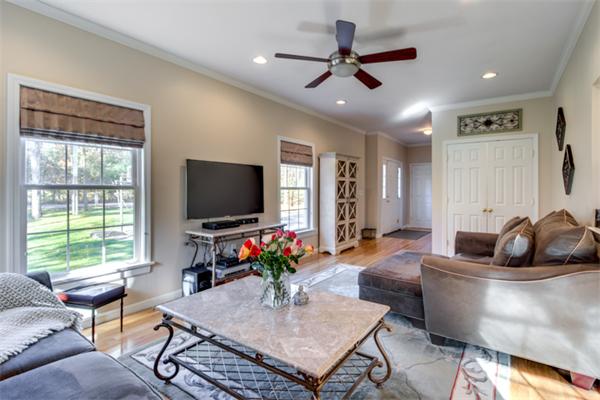 27 A Lawton Road, Unit A Shirley, MA 01464 - Photo 6 of 30 a living room with furniture a window and a flat screen tv