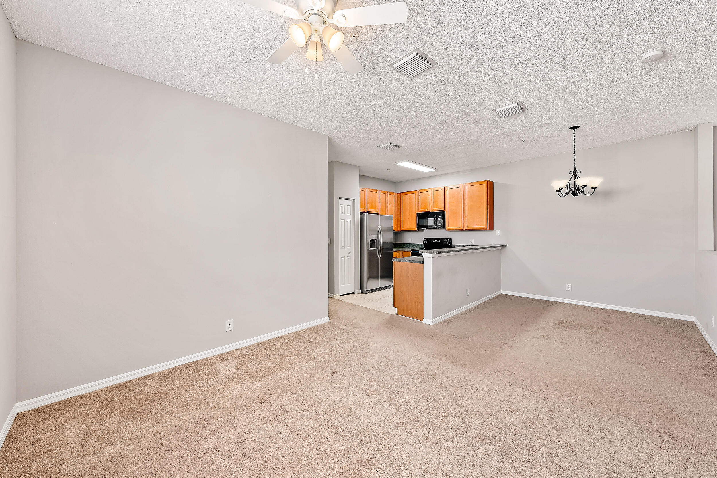 112 Lighthouse Circle, Unit J Tequesta, FL 33469 - Photo 4 of 18 Living Room/Kitchen