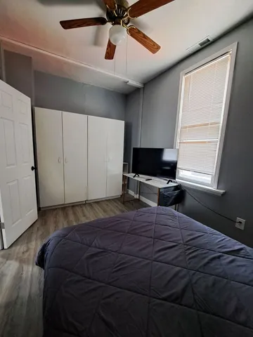 a bathroom with a sink mirror and toilet
