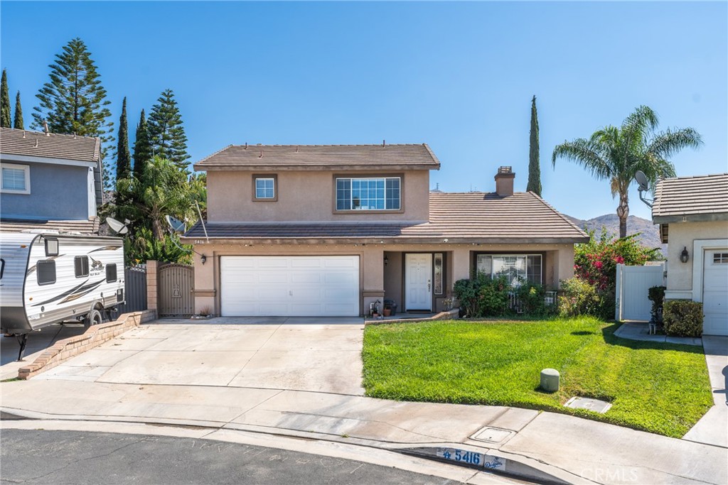 5416 Lauder Court Riverside, CA 92507 - Photo 1 of 1 a front view of a house with a garden and plants